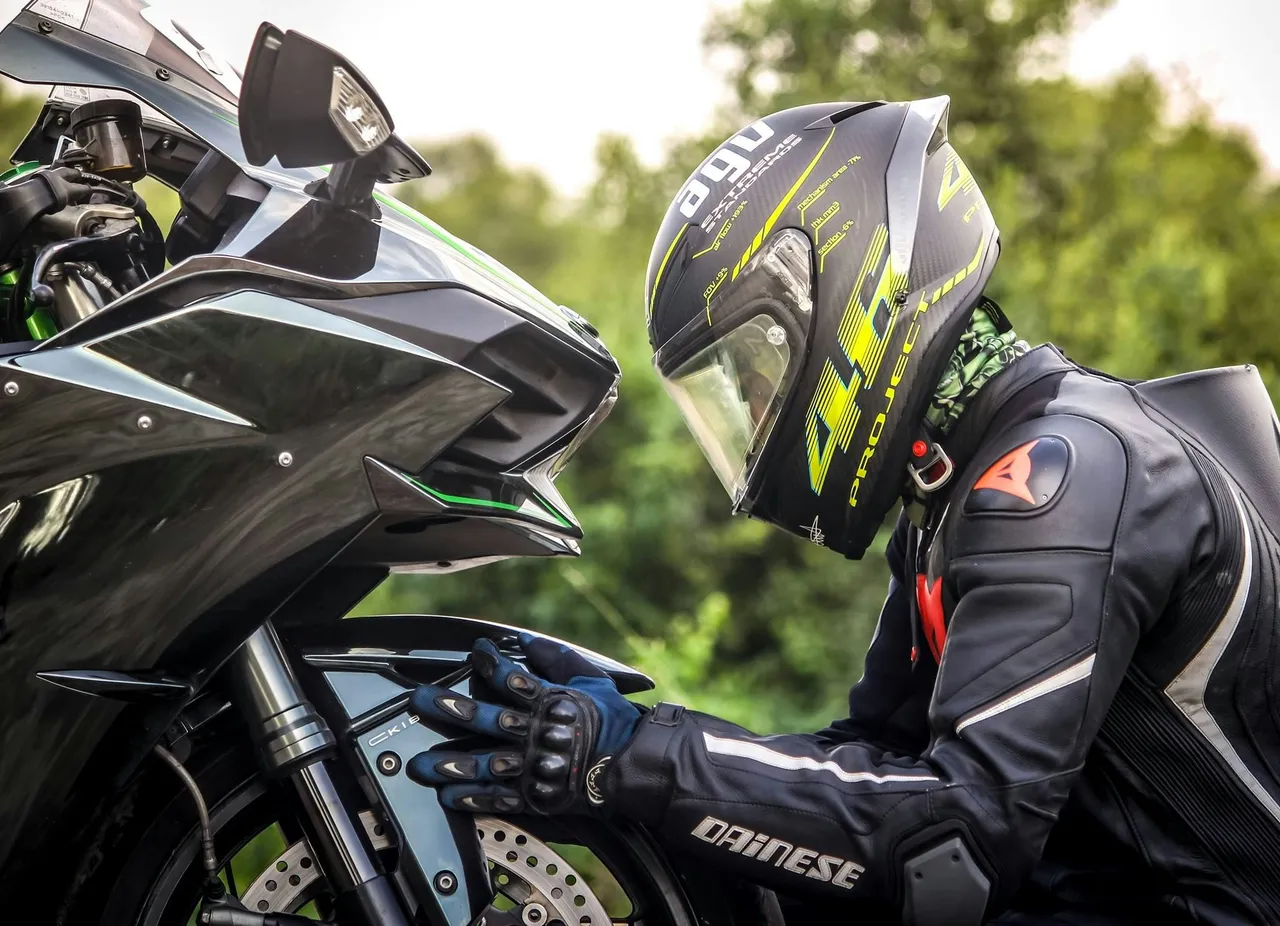 Person checking a motorbike