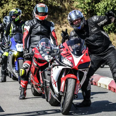 A group of motorbikers getting ready for the training