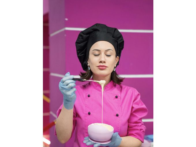 A woman smelling a chocolate cream