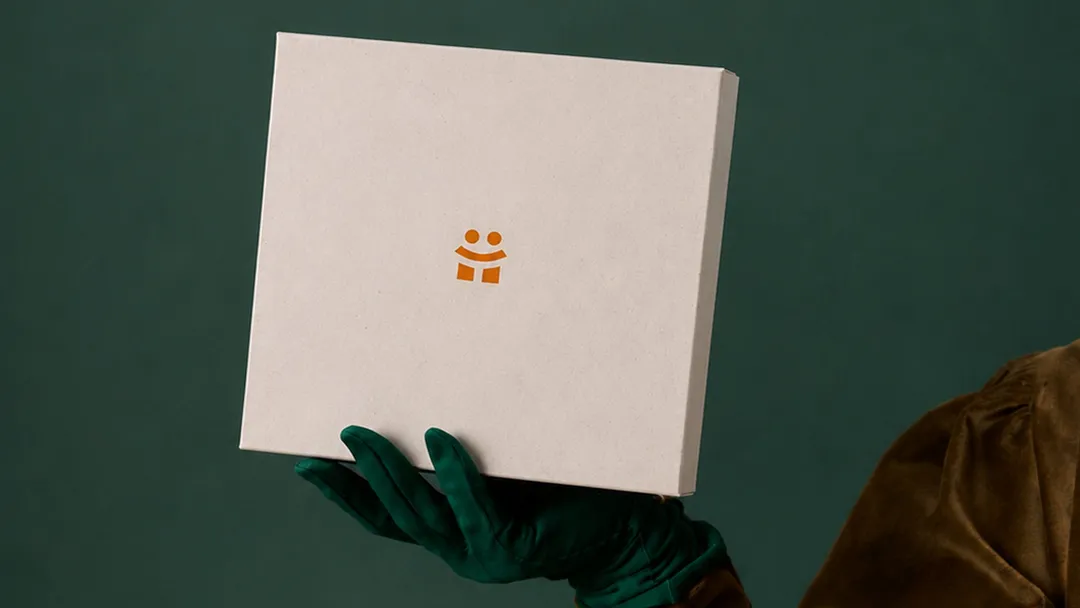 A person holding a gift box