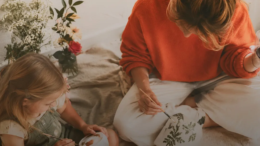 Mother and daughter drawing together