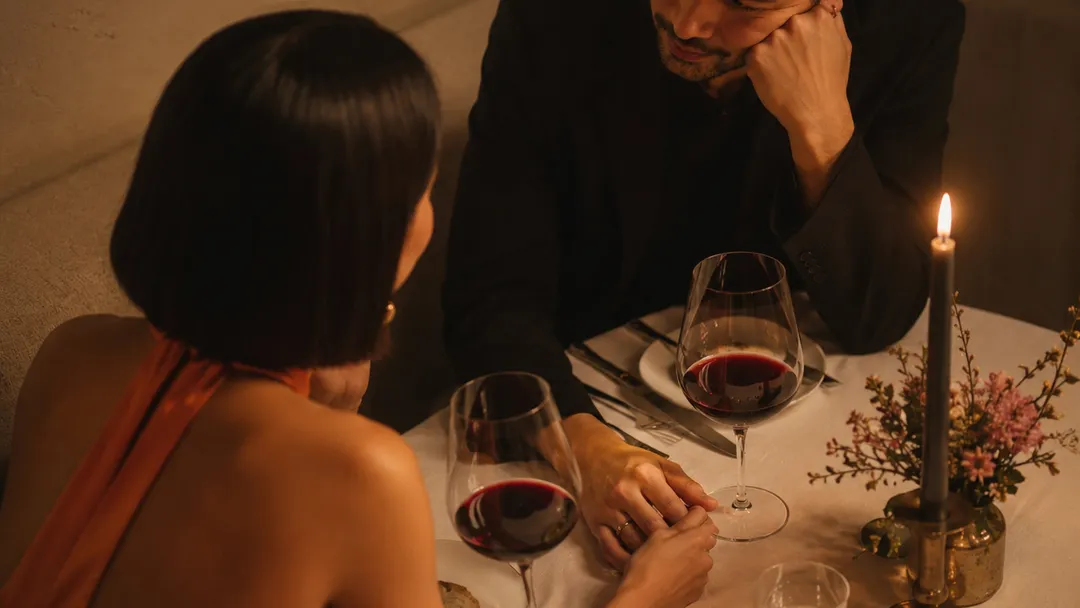 A couple chatting during a romantic dinner