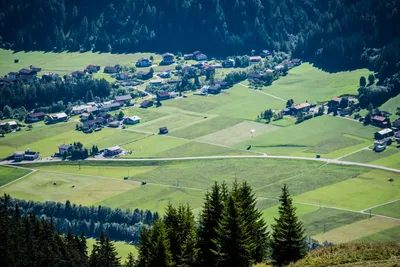 Green valley with a village and meadows in the Lech Valley in Tyrol