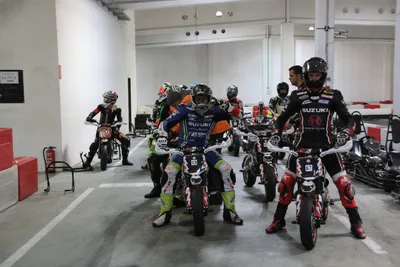 A group of motorbikers getting ready for the training