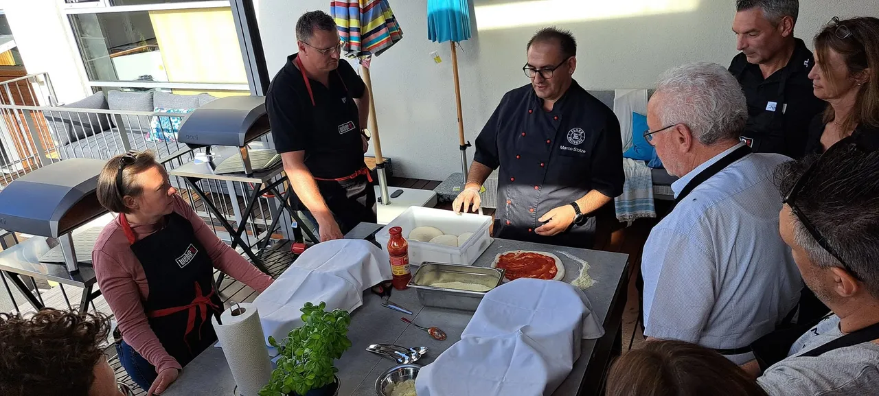 A cook explaining how to prepare the perfect pizza