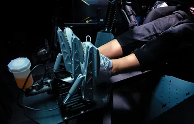 Feet operating a racing simulator
