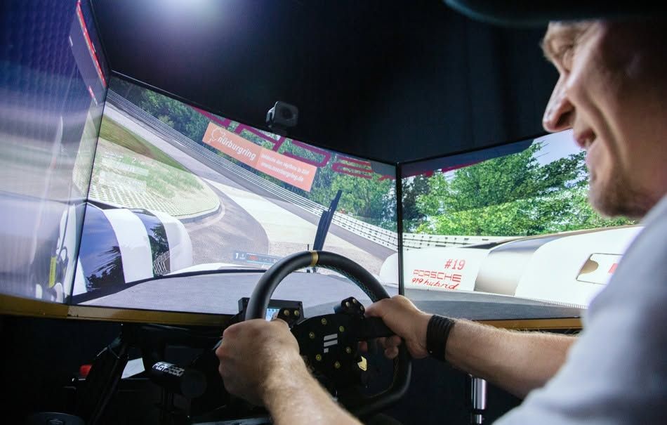 A man operating a racing simulator