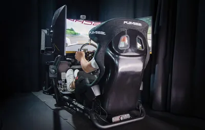 A man inside a racing simulator
