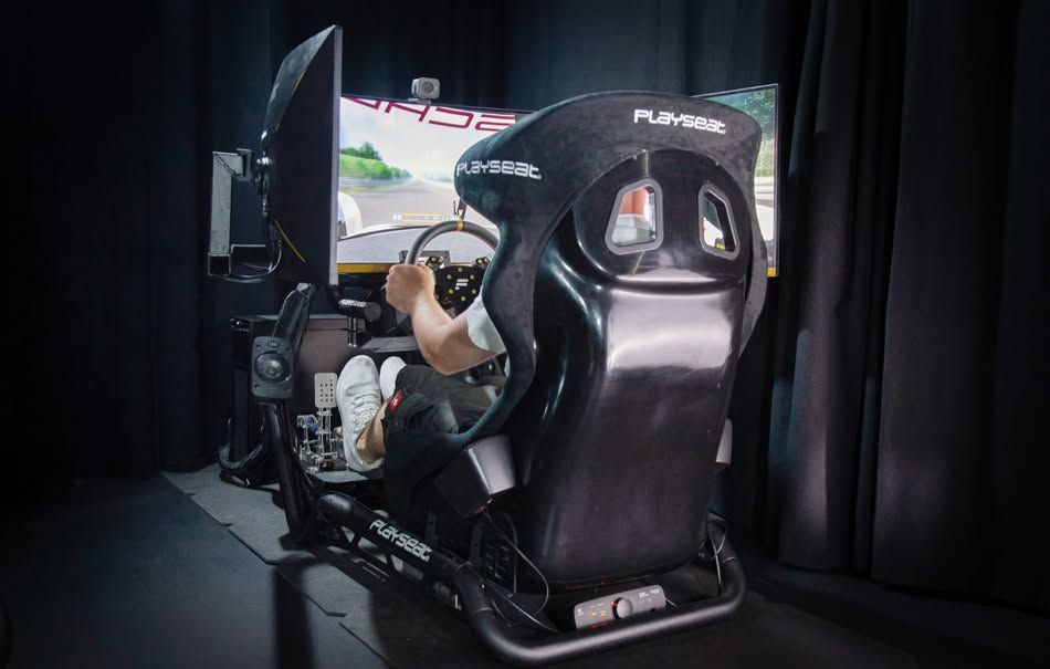 A man inside a racing simulator