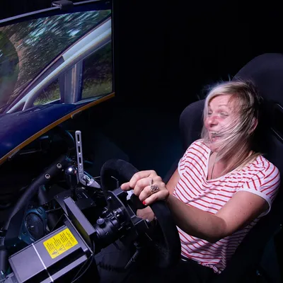 A woman inside a racing simulator