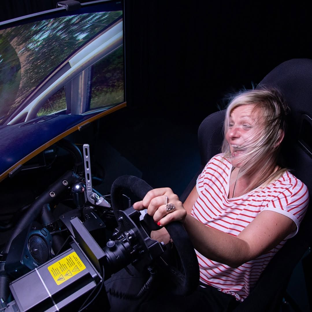 A woman inside a racing simulator