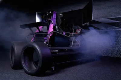 Racing simulator with smoke and dramatic lighting