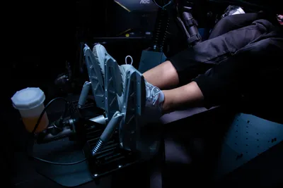 Feet on pedal in racing simulator