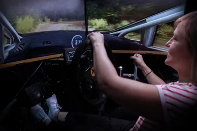 A woman in a racing simulator