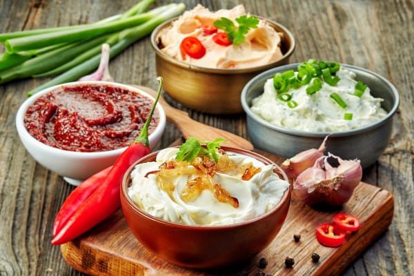 Homemade sauces and dips in small bowls