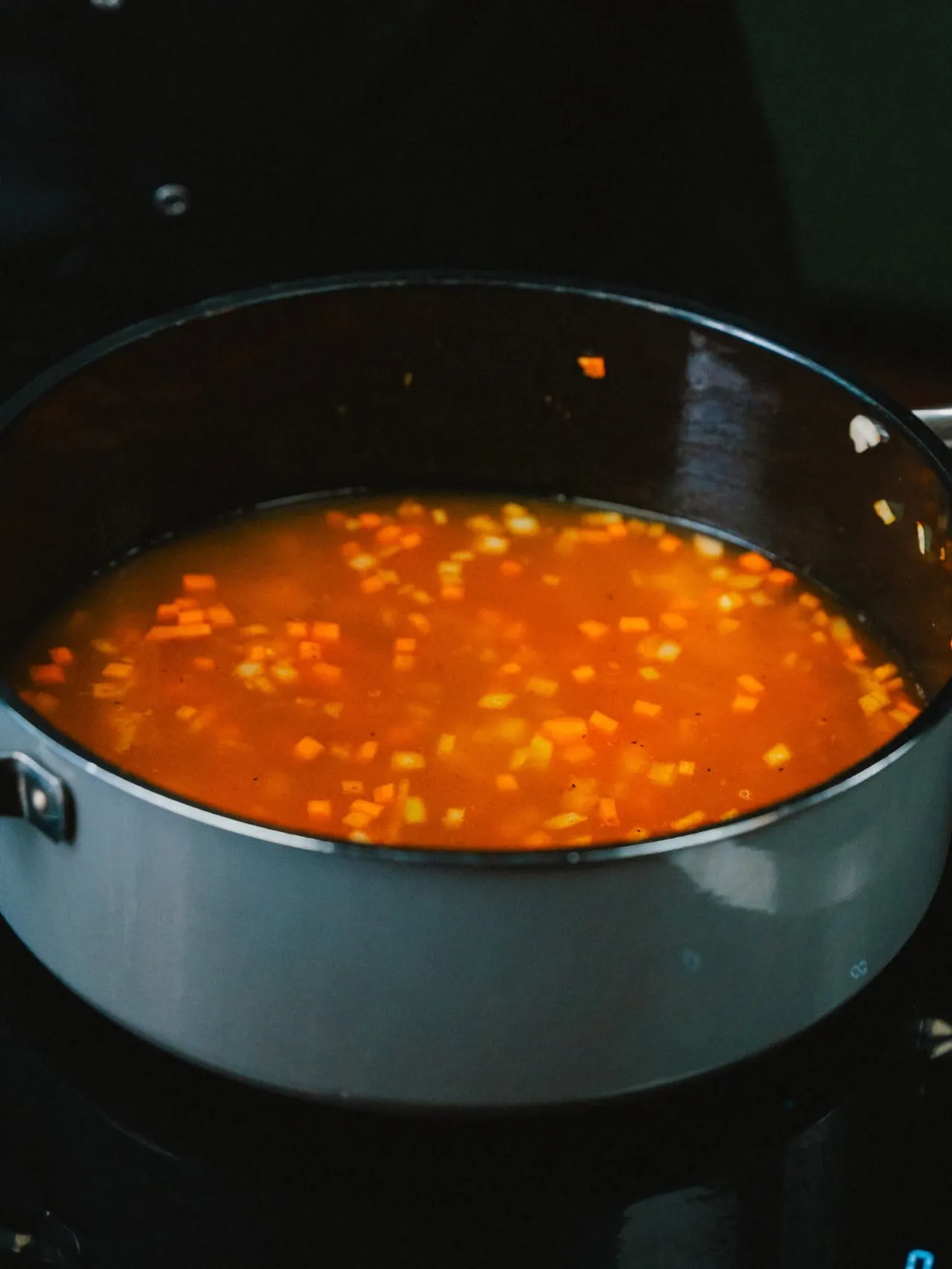 Tomato sauce simmering in a pot