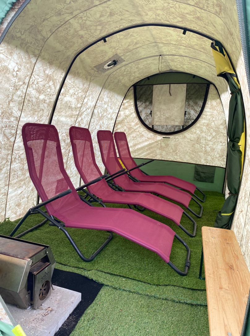 Pink relax loungers in a tent