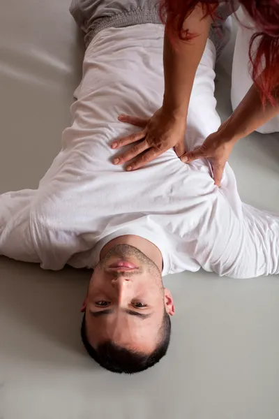 Acupressure massage of male torso