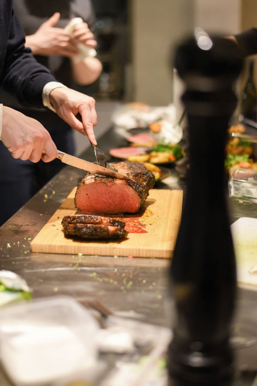 A person cutting meat
