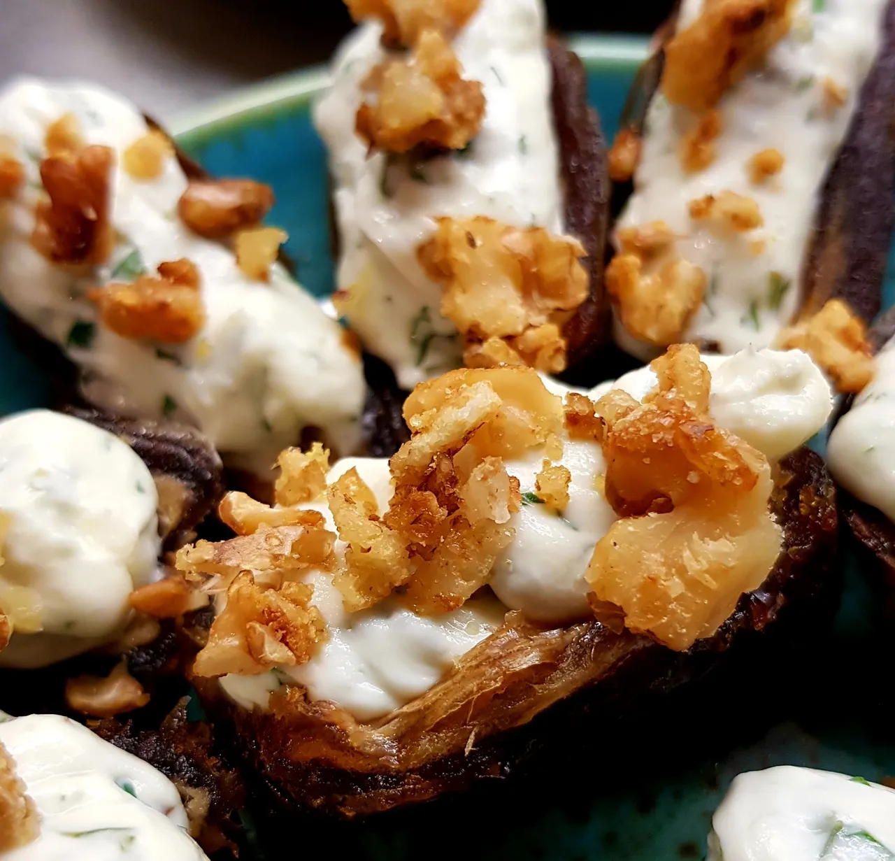 Stuffed dates with creamy topping and nuts