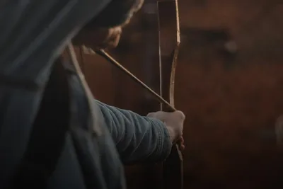 Shooting training: archer drawing a bow