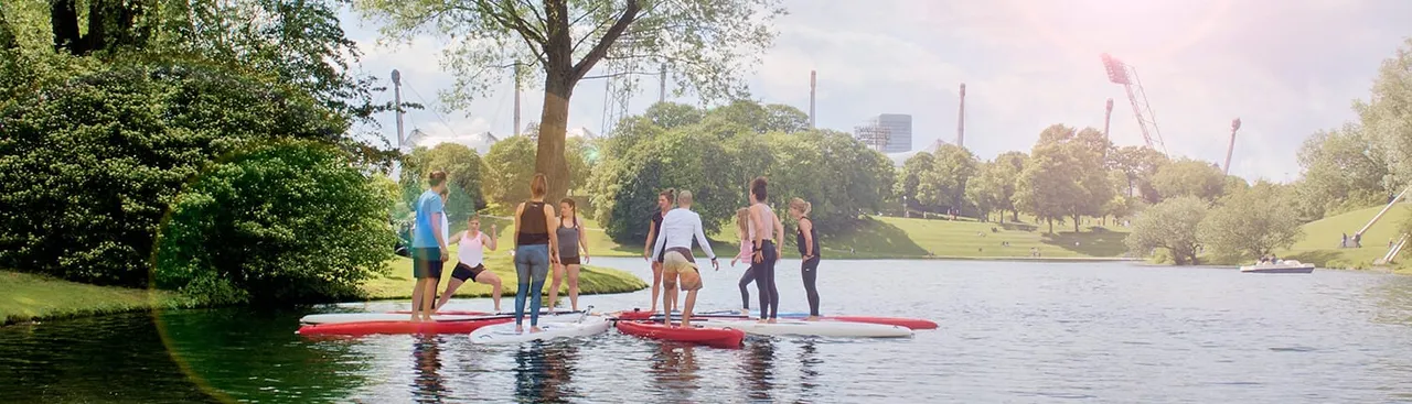 A group of people on SUP boards