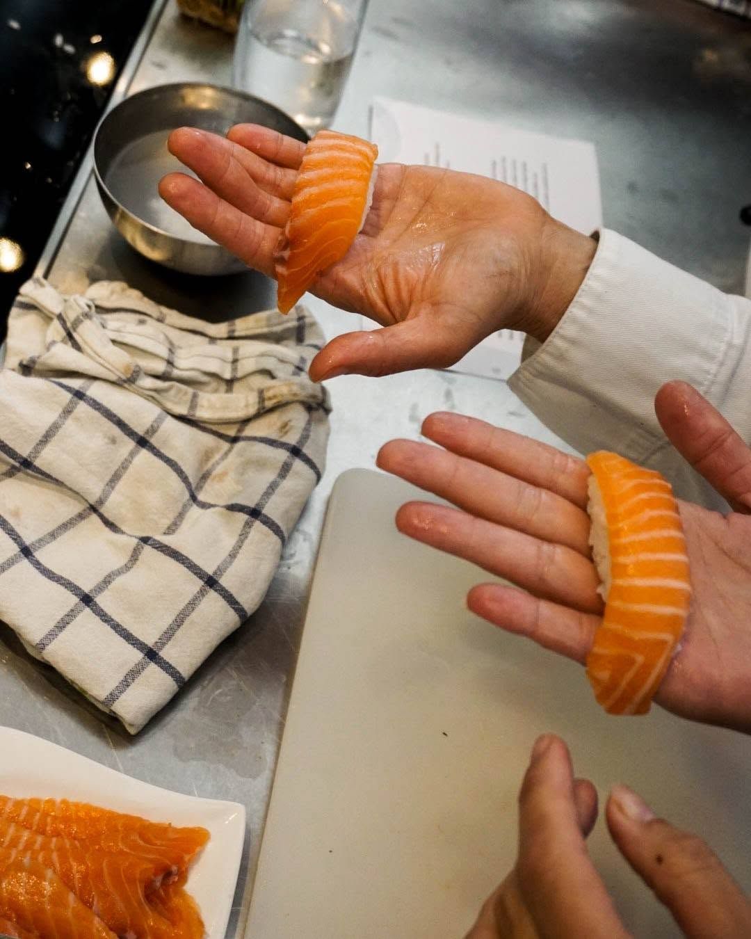 A person preparing sushi