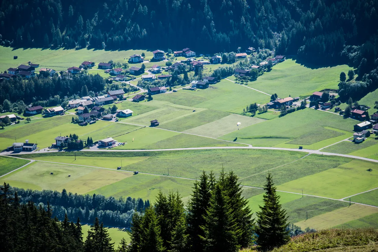 Green valley with a village and meadows in the Lech Valley in Tyrol
