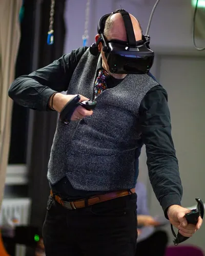 A man playing a virtual game with VR glasses