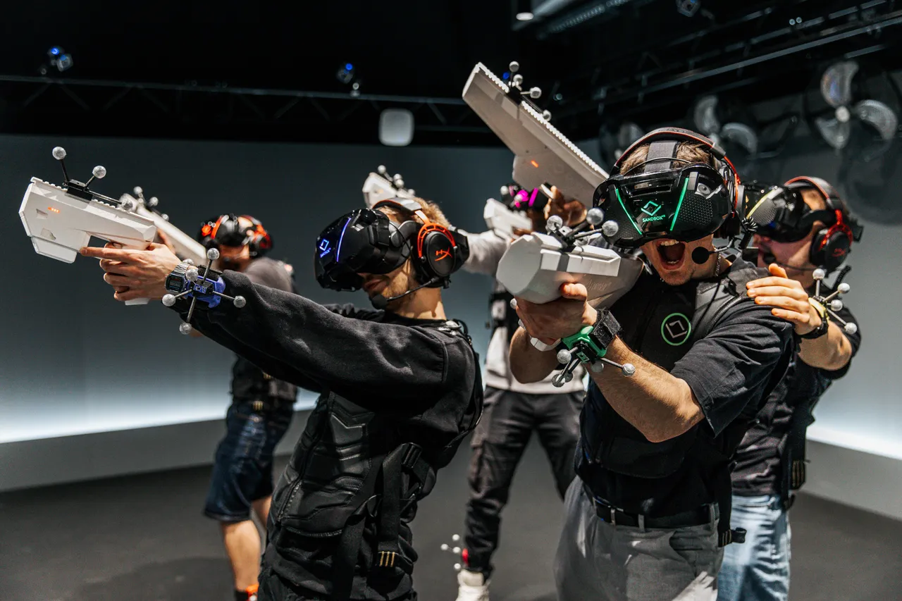 A group of people playing a virtual adventure with guns