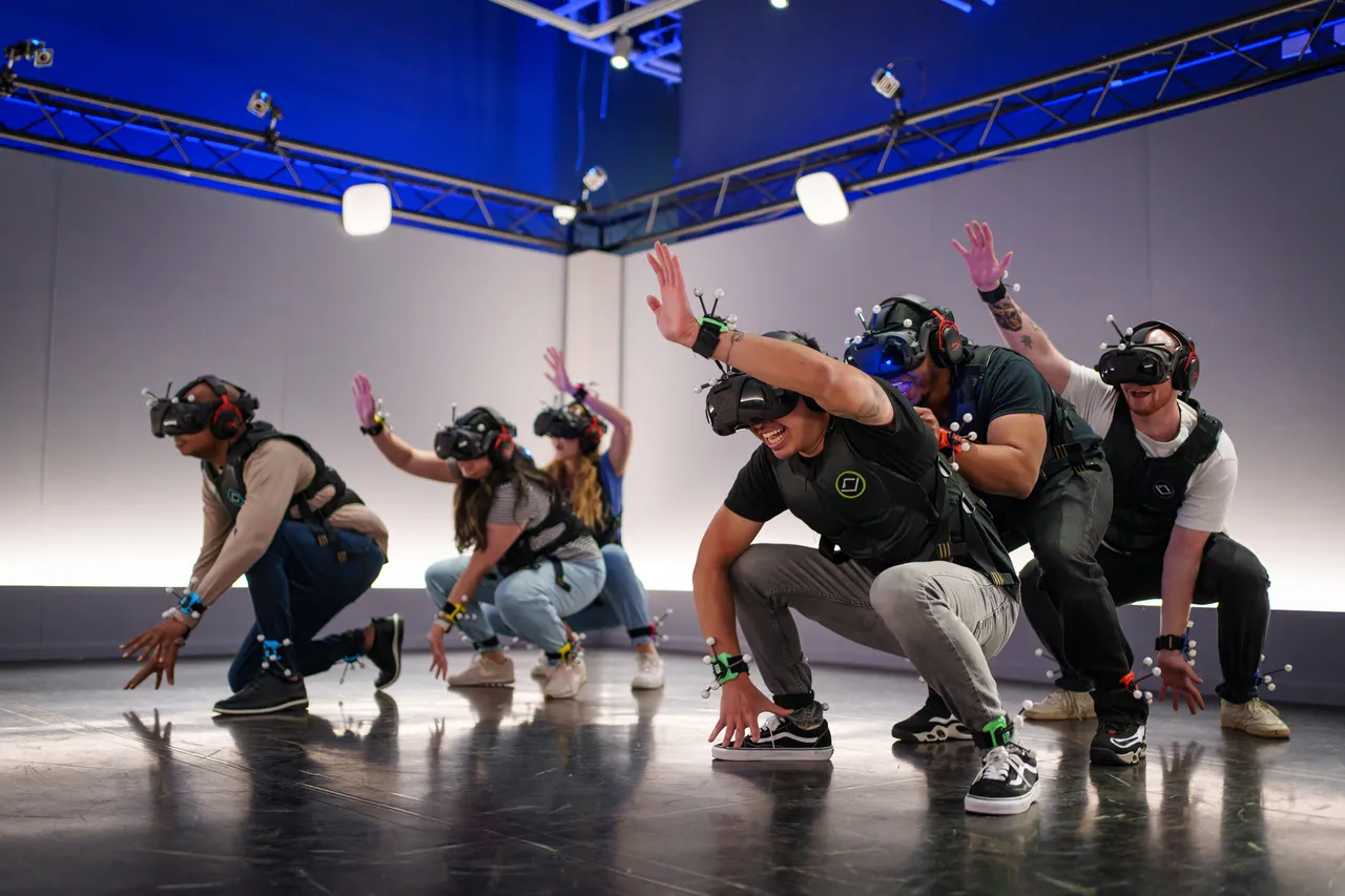 A group of people dancing while wearing VR glasses