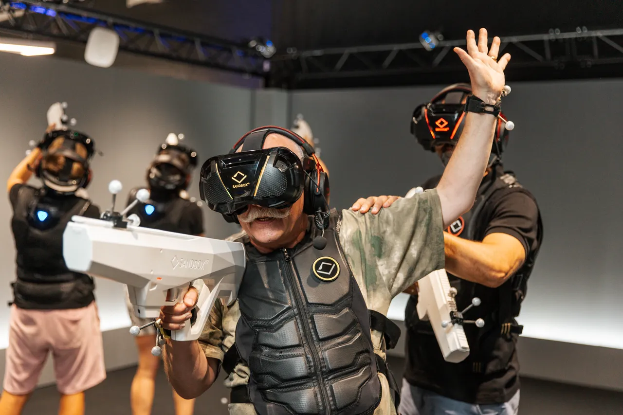 A group of people playing a virtual adventure with guns
