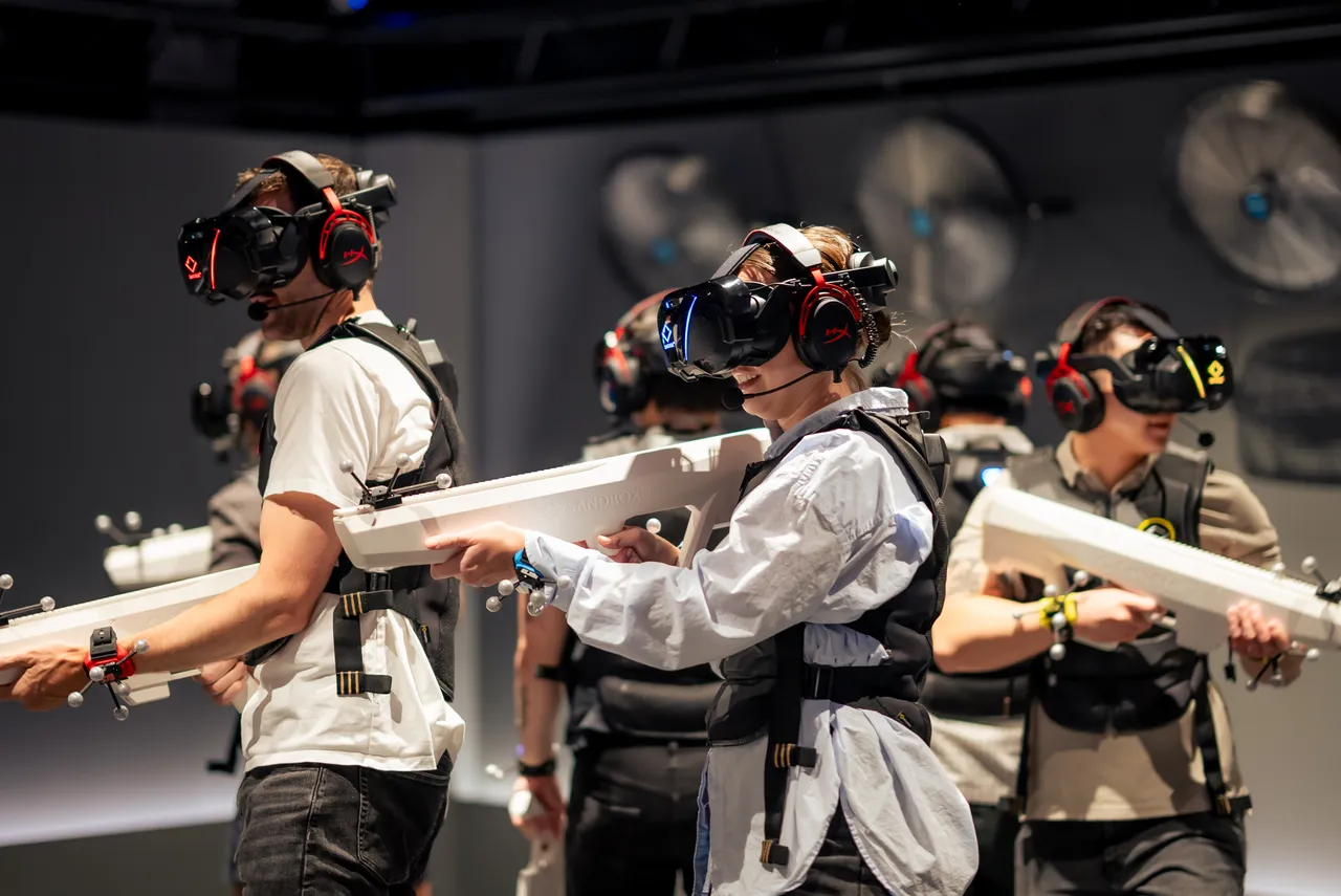A group of people playing a virtual adventure with guns