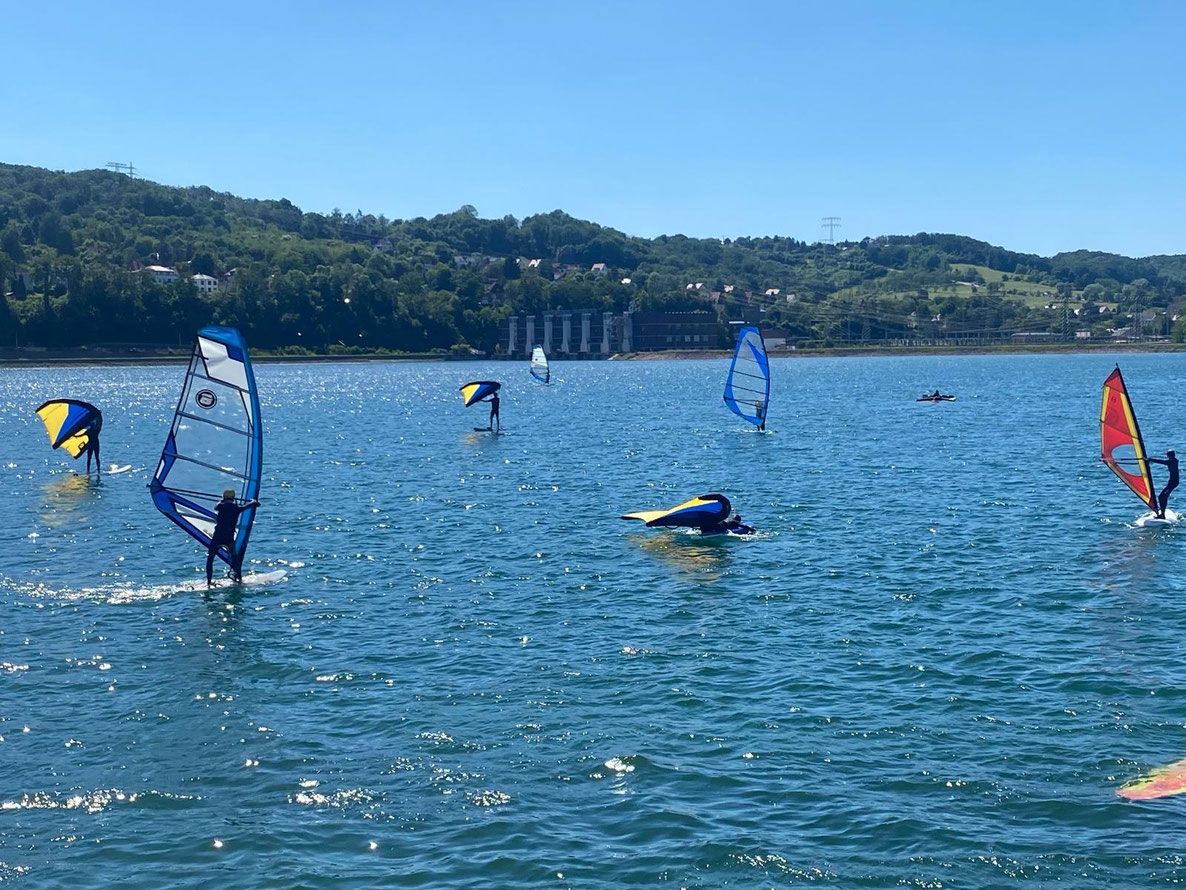 People windsurfing on the water