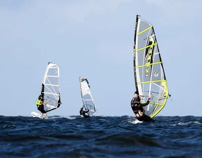 The people windsurfing on the water
