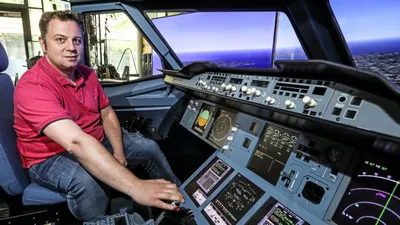 Man in cockpit of a Airbus A380 flight simulator