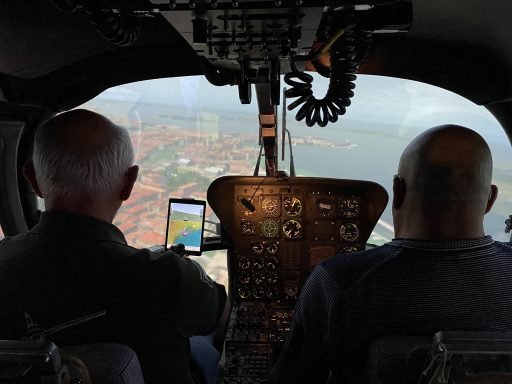 Two people in a helicopter simulator